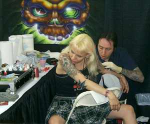Blonde getting tattooed